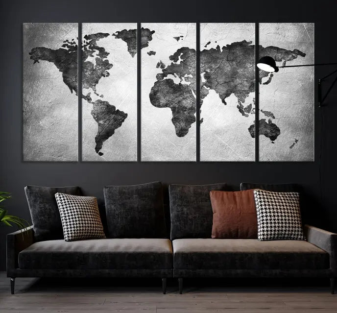 A Black and Gray World Map Canvas Wall Art Print, created on museum-quality canvas with UV-protective coating, hangs prominently.