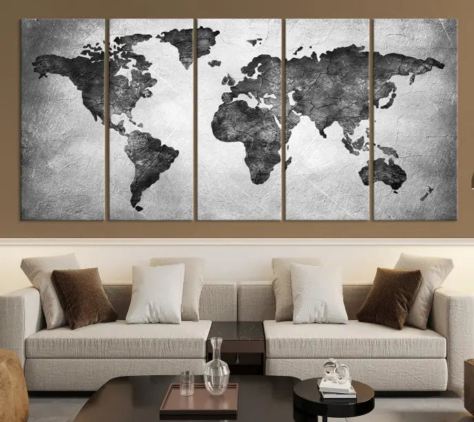 A Black and Gray World Map Canvas Wall Art Print, created on museum-quality canvas with UV-protective coating, hangs prominently.