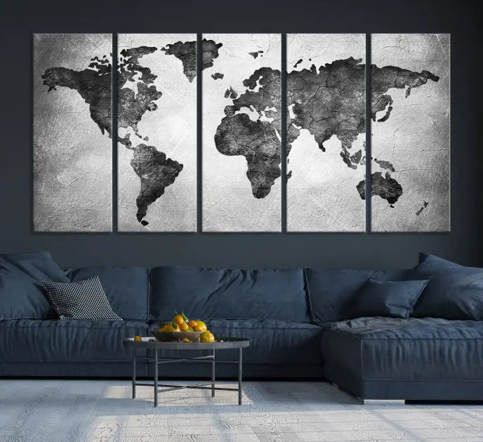 A Black and Gray World Map Canvas Wall Art Print, created on museum-quality canvas with UV-protective coating, hangs prominently.