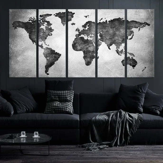 A Black and Gray World Map Canvas Wall Art Print, created on museum-quality canvas with UV-protective coating, hangs prominently.