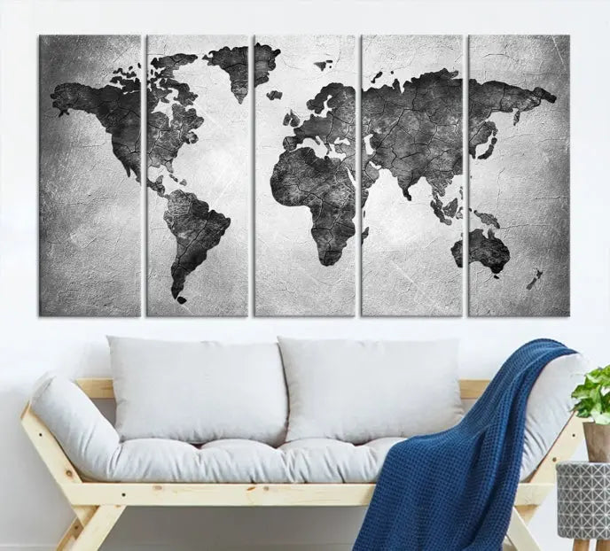 A Black and Gray World Map Canvas Wall Art Print, created on museum-quality canvas with UV-protective coating, hangs prominently.