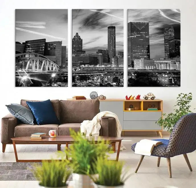 A modern living room featuring the Black and White Atlanta Wall Art Canvas Print as a triptych, displayed on museum-quality canvas and ready to hang.