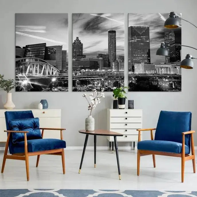 A modern living room featuring the Black and White Atlanta Wall Art Canvas Print as a triptych, displayed on museum-quality canvas and ready to hang.