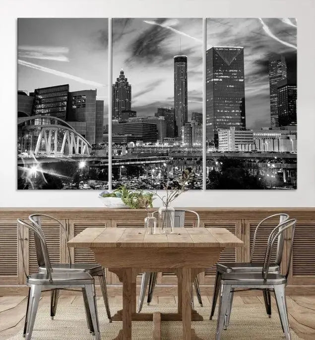 A modern living room featuring the Black and White Atlanta Wall Art Canvas Print as a triptych, displayed on museum-quality canvas and ready to hang.