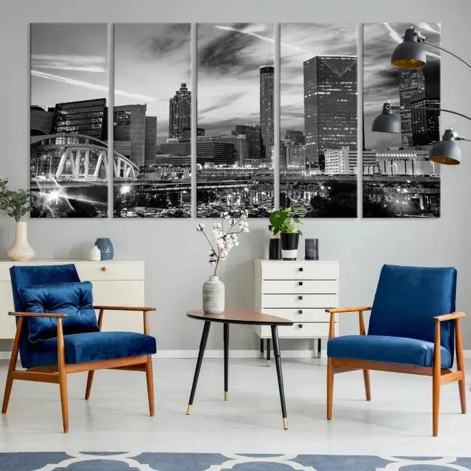 A modern living room featuring the Black and White Atlanta Wall Art Canvas Print as a triptych, displayed on museum-quality canvas and ready to hang.