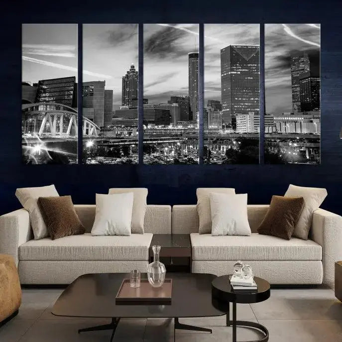 A modern living room featuring the Black and White Atlanta Wall Art Canvas Print as a triptych, displayed on museum-quality canvas and ready to hang.