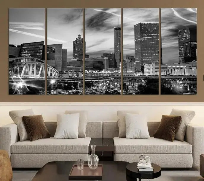 A modern living room featuring the Black and White Atlanta Wall Art Canvas Print as a triptych, displayed on museum-quality canvas and ready to hang.