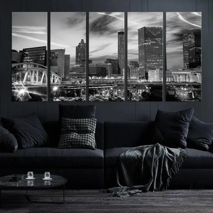 A modern living room featuring the Black and White Atlanta Wall Art Canvas Print as a triptych, displayed on museum-quality canvas and ready to hang.