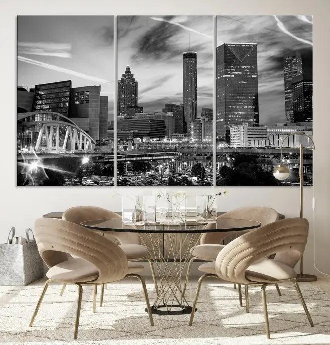 A modern living room featuring the Black and White Atlanta Wall Art Canvas Print as a triptych, displayed on museum-quality canvas and ready to hang.