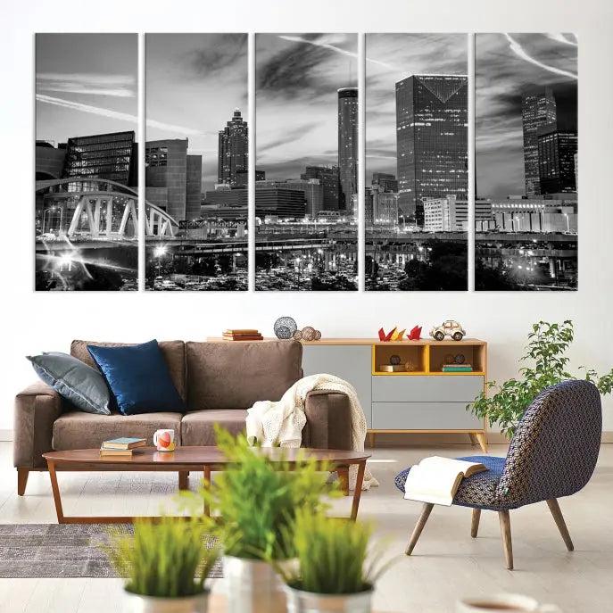 A modern living room featuring the Black and White Atlanta Wall Art Canvas Print as a triptych, displayed on museum-quality canvas and ready to hang.