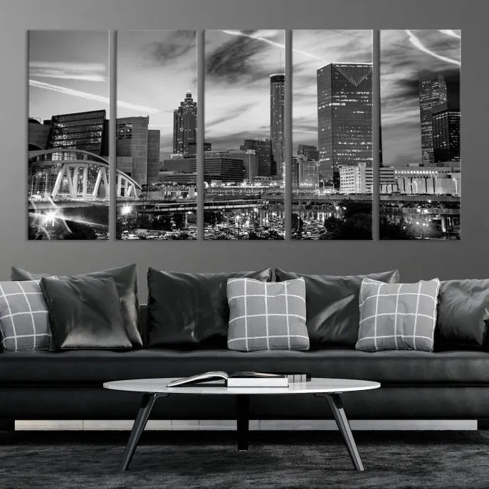 A modern living room featuring the Black and White Atlanta Wall Art Canvas Print as a triptych, displayed on museum-quality canvas and ready to hang.