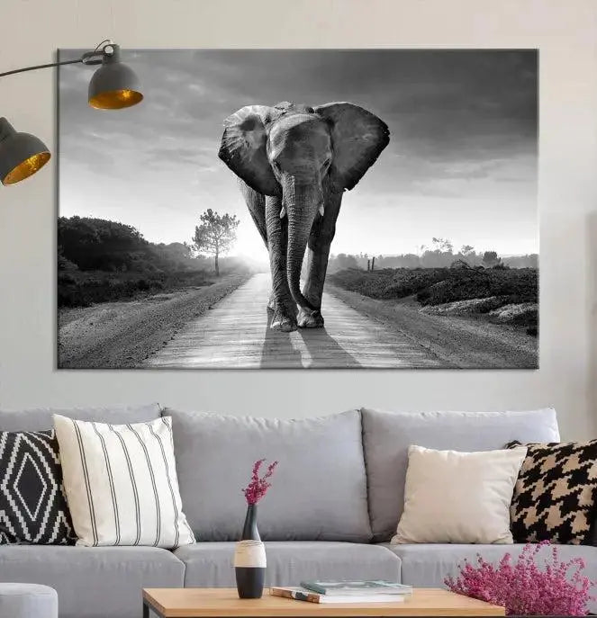 Black and White Elephant Wall Art Canvas Print is displayed as a triptych on museum-quality canvases, elegantly showcased on a dark wall. Each piece is ready to hang and features a durable UV-protective coating.