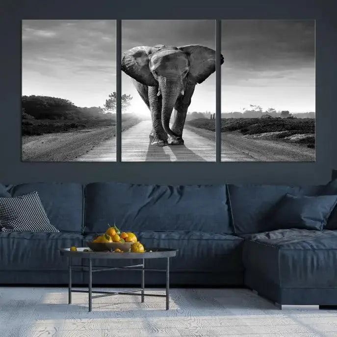 Black and White Elephant Wall Art Canvas Print is displayed as a triptych on museum-quality canvases, elegantly showcased on a dark wall. Each piece is ready to hang and features a durable UV-protective coating.