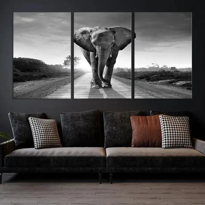 Black and White Elephant Wall Art Canvas Print is displayed as a triptych on museum-quality canvases, elegantly showcased on a dark wall. Each piece is ready to hang and features a durable UV-protective coating.