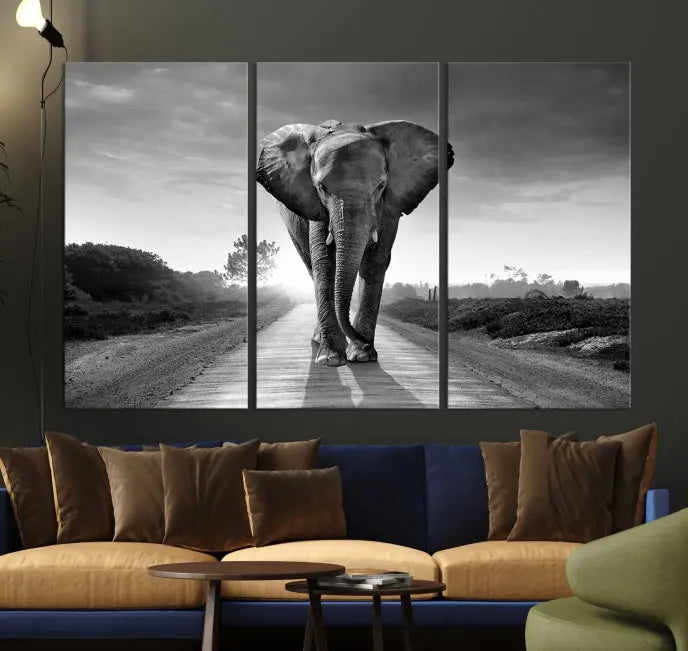 Black and White Elephant Wall Art Canvas Print is displayed as a triptych on museum-quality canvases, elegantly showcased on a dark wall. Each piece is ready to hang and features a durable UV-protective coating.