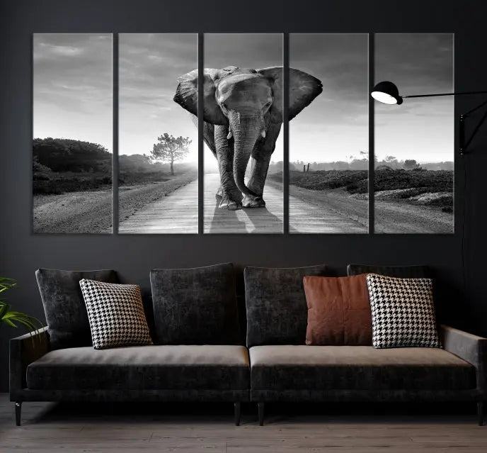 Black and White Elephant Wall Art Canvas Print is displayed as a triptych on museum-quality canvases, elegantly showcased on a dark wall. Each piece is ready to hang and features a durable UV-protective coating.