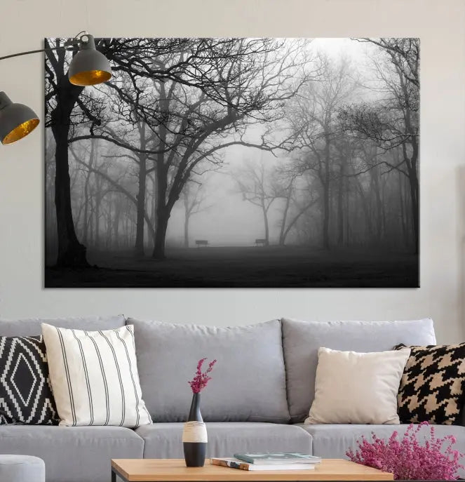 The wall displays the Black and White Foggy Forest Wall Art Canvas Print, carefully gallery wrapped and made from museum-quality pollycotton for an exquisite touch.