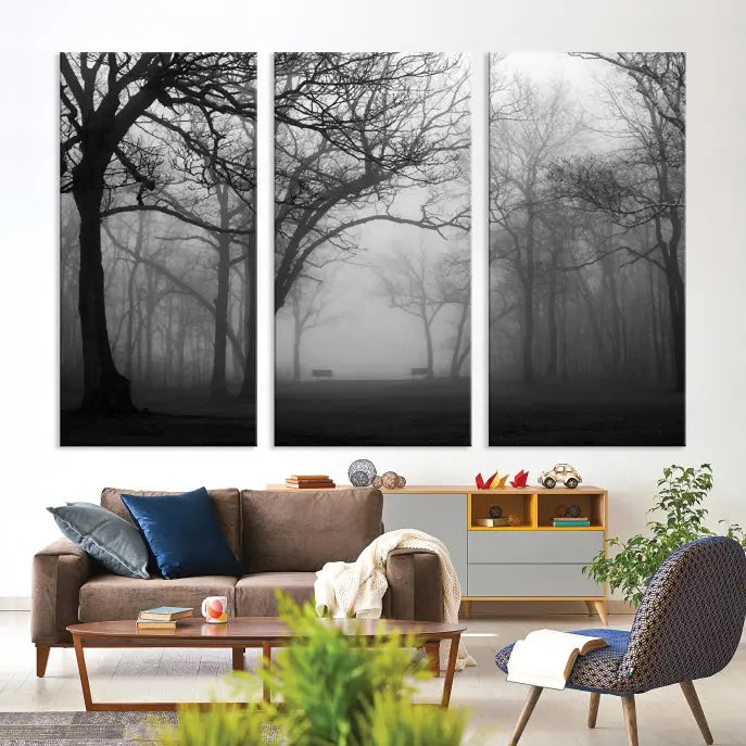 The wall displays the Black and White Foggy Forest Wall Art Canvas Print, carefully gallery wrapped and made from museum-quality pollycotton for an exquisite touch.