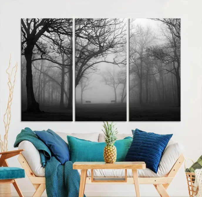 The wall displays the Black and White Foggy Forest Wall Art Canvas Print, carefully gallery wrapped and made from museum-quality pollycotton for an exquisite touch.