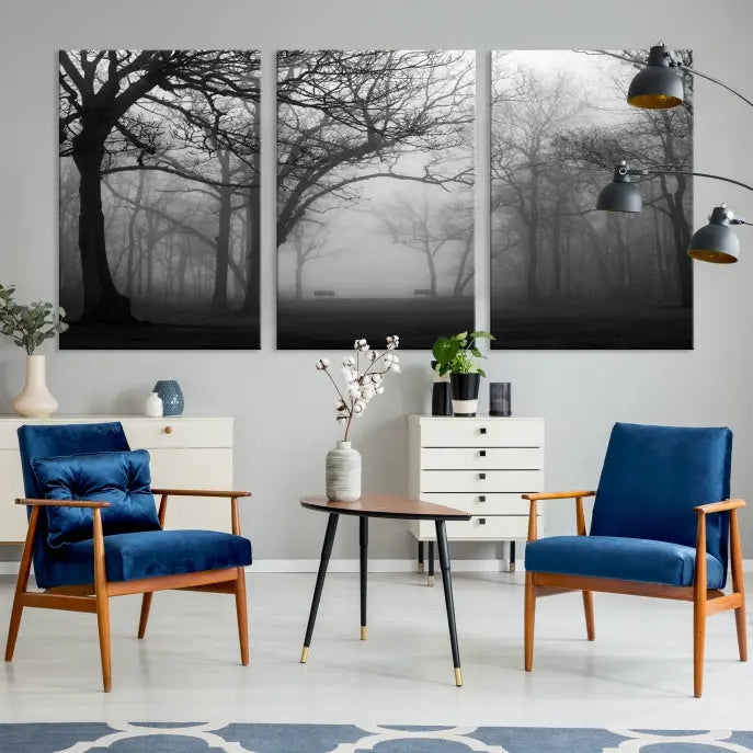 The wall displays the Black and White Foggy Forest Wall Art Canvas Print, carefully gallery wrapped and made from museum-quality pollycotton for an exquisite touch.