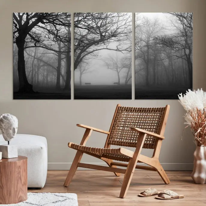 The wall displays the Black and White Foggy Forest Wall Art Canvas Print, carefully gallery wrapped and made from museum-quality pollycotton for an exquisite touch.