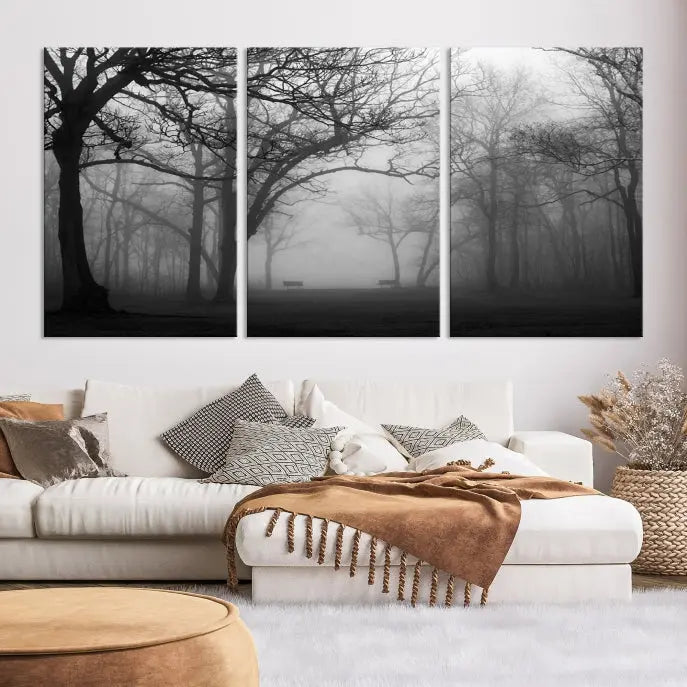 The wall displays the Black and White Foggy Forest Wall Art Canvas Print, carefully gallery wrapped and made from museum-quality pollycotton for an exquisite touch.