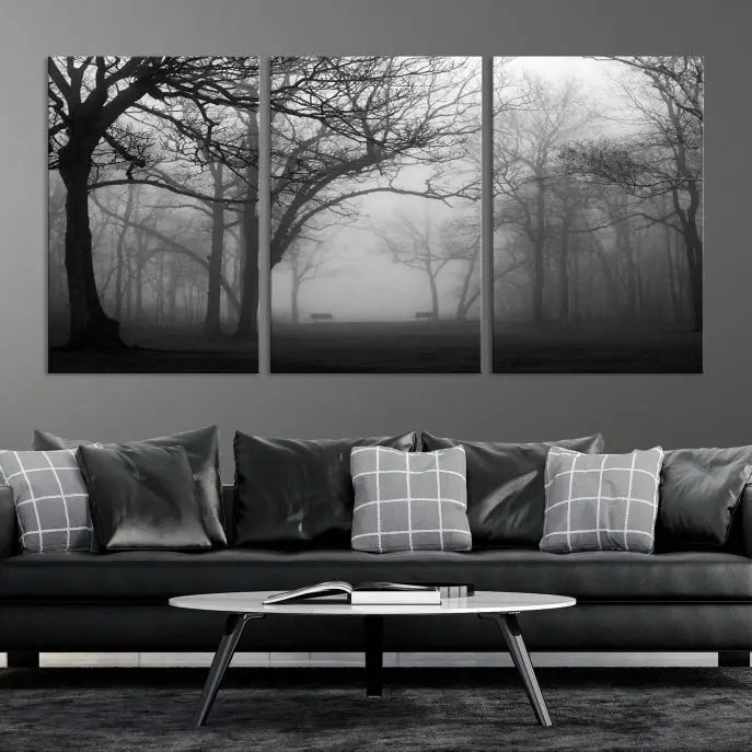 The wall displays the Black and White Foggy Forest Wall Art Canvas Print, carefully gallery wrapped and made from museum-quality pollycotton for an exquisite touch.