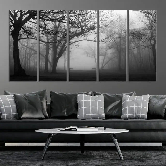 The wall displays the Black and White Foggy Forest Wall Art Canvas Print, carefully gallery wrapped and made from museum-quality pollycotton for an exquisite touch.