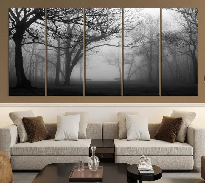 The wall displays the Black and White Foggy Forest Wall Art Canvas Print, carefully gallery wrapped and made from museum-quality pollycotton for an exquisite touch.