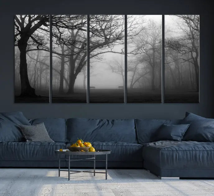 The wall displays the Black and White Foggy Forest Wall Art Canvas Print, carefully gallery wrapped and made from museum-quality pollycotton for an exquisite touch.