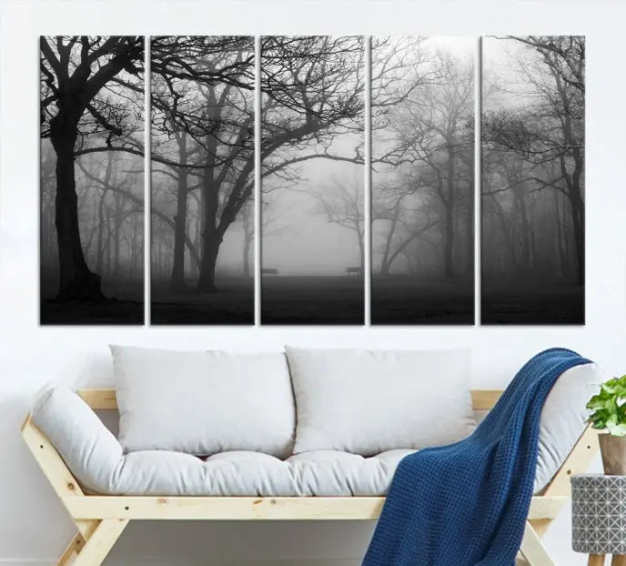 The wall displays the Black and White Foggy Forest Wall Art Canvas Print, carefully gallery wrapped and made from museum-quality pollycotton for an exquisite touch.