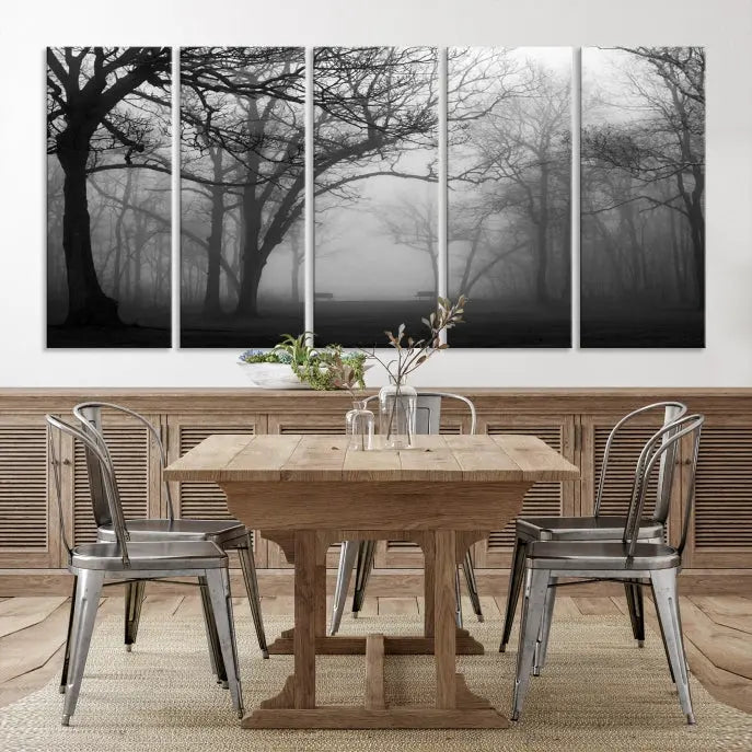 The wall displays the Black and White Foggy Forest Wall Art Canvas Print, carefully gallery wrapped and made from museum-quality pollycotton for an exquisite touch.