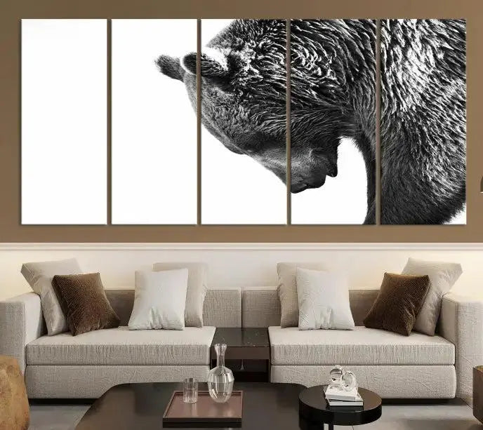 A black and white triptych from the "Black and White Grizzly 399 Bear Canvas Print Wall Art" collection decorates the dark wall.