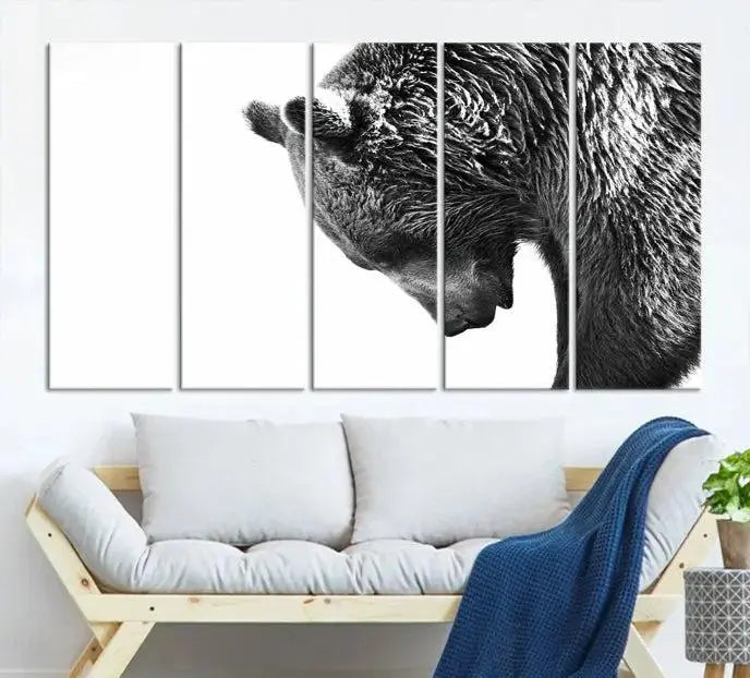 A black and white triptych from the "Black and White Grizzly 399 Bear Canvas Print Wall Art" collection decorates the dark wall.