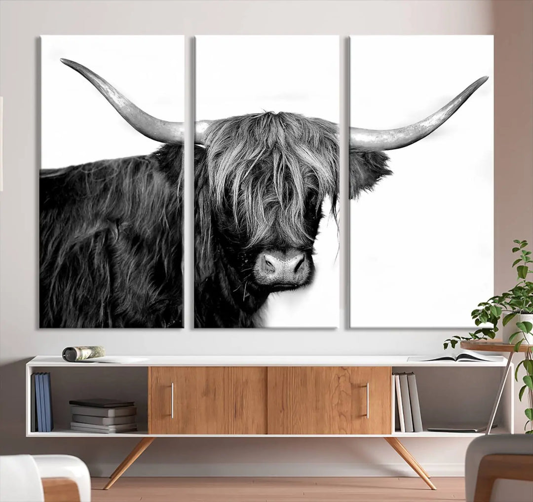 A Black and White Highland Cow Multi Panel Wall Art Canvas Print with UV-protective coating is displayed.