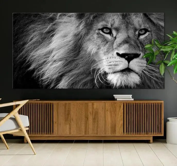 The Black and White Lion Canvas Wall Art Print, a hand-assembled triptych featuring the majestic face of a lion, hangs above. These stunning canvas prints come with free shipping.