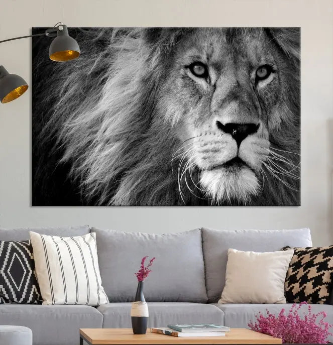 The Black and White Lion Canvas Wall Art Print, a hand-assembled triptych featuring the majestic face of a lion, hangs above. These stunning canvas prints come with free shipping.