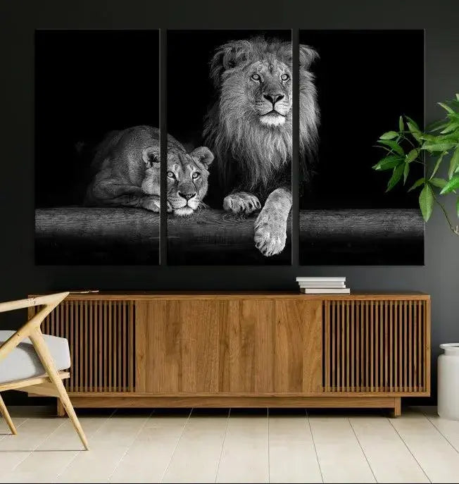 A triptych of the Black and White Lion Couple Wall Art Canvas Print hangs elegantly, showcasing museum-quality, hand-assembled framed art pieces. Enjoy free shipping on this stunning artwork.