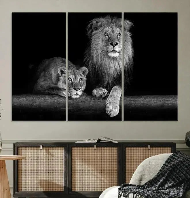 A triptych of the Black and White Lion Couple Wall Art Canvas Print hangs elegantly, showcasing museum-quality, hand-assembled framed art pieces. Enjoy free shipping on this stunning artwork.