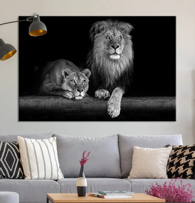 A triptych of the Black and White Lion Couple Wall Art Canvas Print hangs elegantly, showcasing museum-quality, hand-assembled framed art pieces. Enjoy free shipping on this stunning artwork.