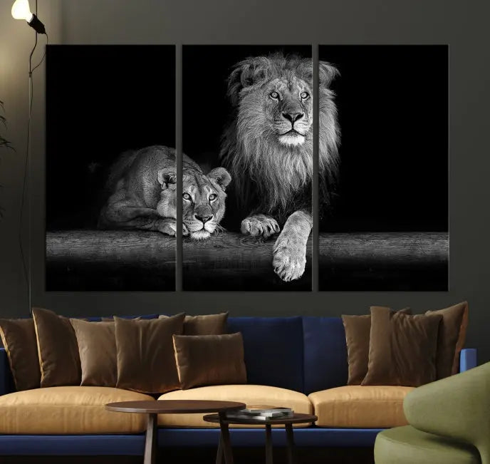 A triptych of the Black and White Lion Couple Wall Art Canvas Print hangs elegantly, showcasing museum-quality, hand-assembled framed art pieces. Enjoy free shipping on this stunning artwork.