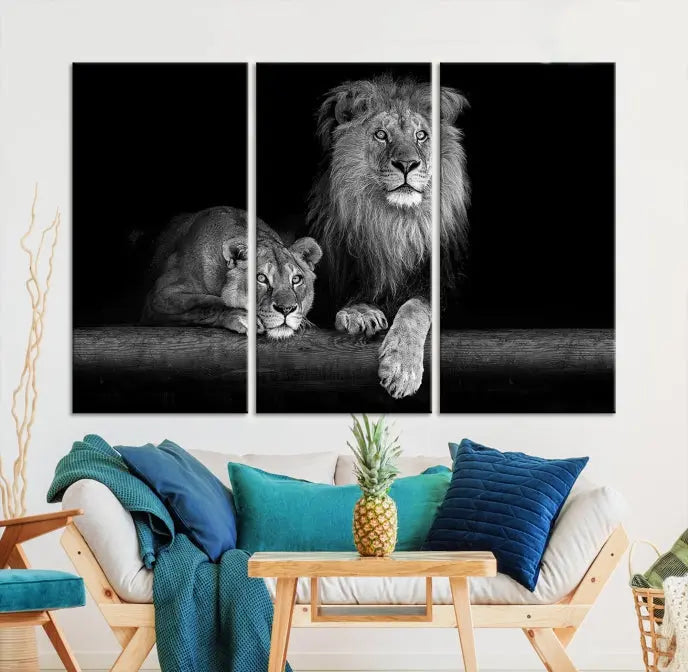 A triptych of the Black and White Lion Couple Wall Art Canvas Print hangs elegantly, showcasing museum-quality, hand-assembled framed art pieces. Enjoy free shipping on this stunning artwork.