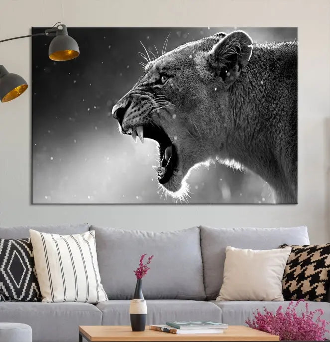 A stunning centerpiece for the living room, the Black and White Lioness Wall Art Canvas Print graces the wall.