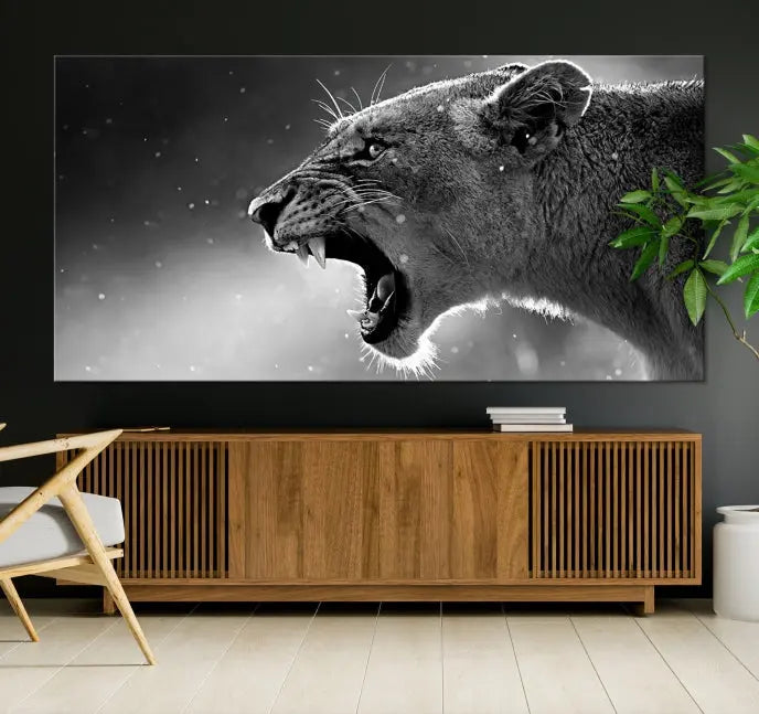 A stunning centerpiece for the living room, the Black and White Lioness Wall Art Canvas Print graces the wall.