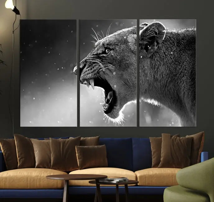 A stunning centerpiece for the living room, the Black and White Lioness Wall Art Canvas Print graces the wall.