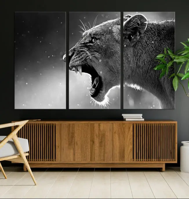 A stunning centerpiece for the living room, the Black and White Lioness Wall Art Canvas Print graces the wall.