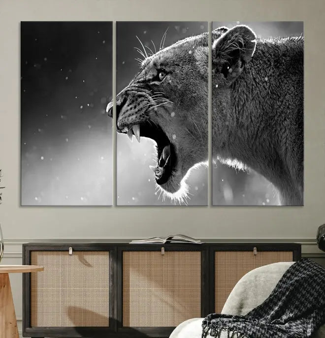 A stunning centerpiece for the living room, the Black and White Lioness Wall Art Canvas Print graces the wall.