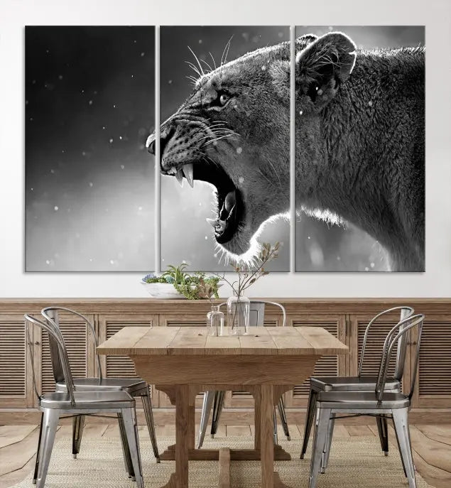 A stunning centerpiece for the living room, the Black and White Lioness Wall Art Canvas Print graces the wall.