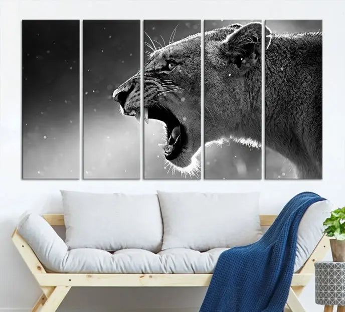 A stunning centerpiece for the living room, the Black and White Lioness Wall Art Canvas Print graces the wall.