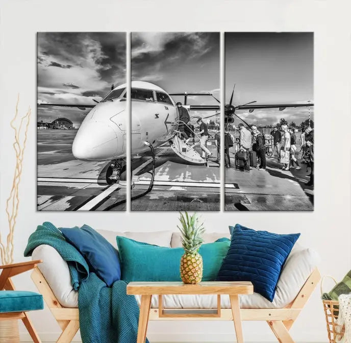 Introducing the Black and White Narrow Body Aircraft Wall Art Canvas Print: This striking three-panel canvas features a timeless black-and-white depiction of people boarding a propeller airplane. Printed on museum-quality canvas, each piece is UV-protected to maintain its vibrancy. These prints are ready to hang, making it easy to display them with ease.